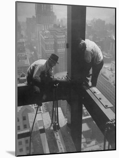 Workmen Attaching Steel Beams High Above Street During Construction of Manhattan Company Building-Arthur Gerlach-Mounted Photographic Print