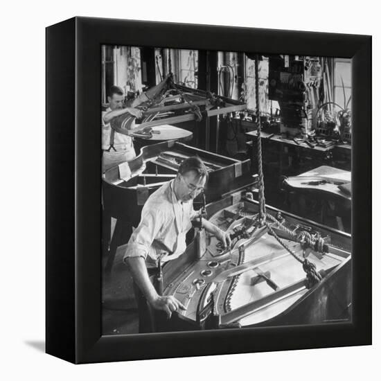 Workmen Installing Steel String Frames Into Grand Piano Cabinets at Steinway Piano Factory-Margaret Bourke-White-Framed Premier Image Canvas