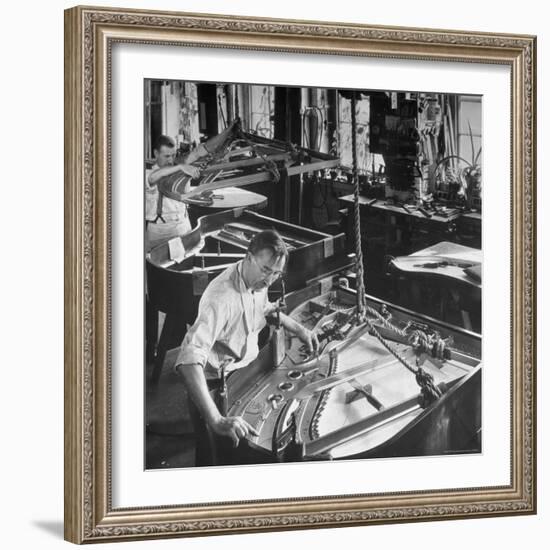 Workmen Installing Steel String Frames Into Grand Piano Cabinets at Steinway Piano Factory-Margaret Bourke-White-Framed Photographic Print