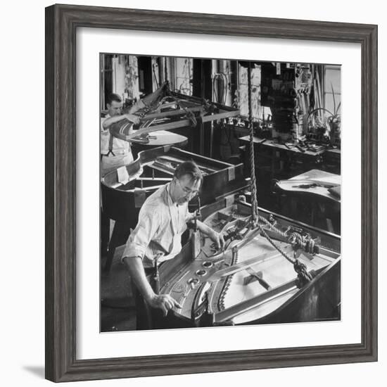 Workmen Installing Steel String Frames Into Grand Piano Cabinets at Steinway Piano Factory-Margaret Bourke-White-Framed Photographic Print