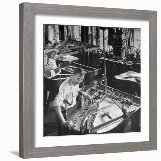 Workmen Installing Steel String Frames Into Grand Piano Cabinets at Steinway Piano Factory-Margaret Bourke-White-Framed Photographic Print