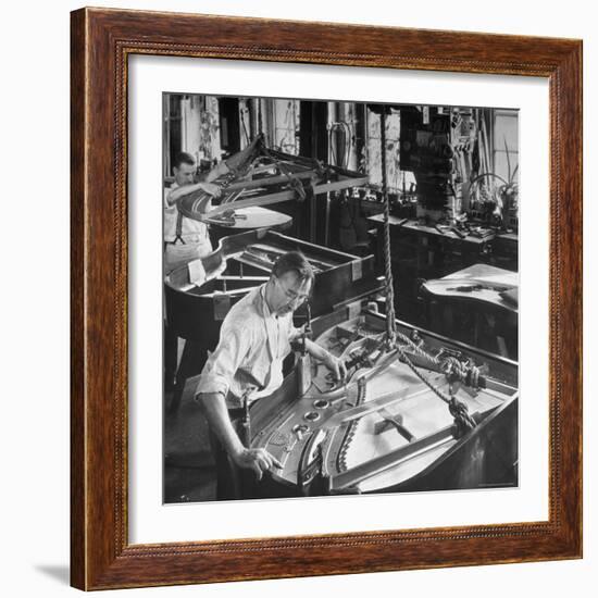 Workmen Installing Steel String Frames Into Grand Piano Cabinets at Steinway Piano Factory-Margaret Bourke-White-Framed Photographic Print