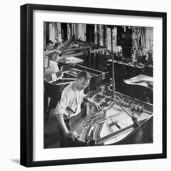 Workmen Installing Steel String Frames Into Grand Piano Cabinets at Steinway Piano Factory-Margaret Bourke-White-Framed Photographic Print