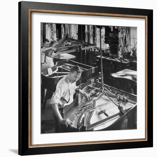 Workmen Installing Steel String Frames Into Grand Piano Cabinets at Steinway Piano Factory-Margaret Bourke-White-Framed Photographic Print