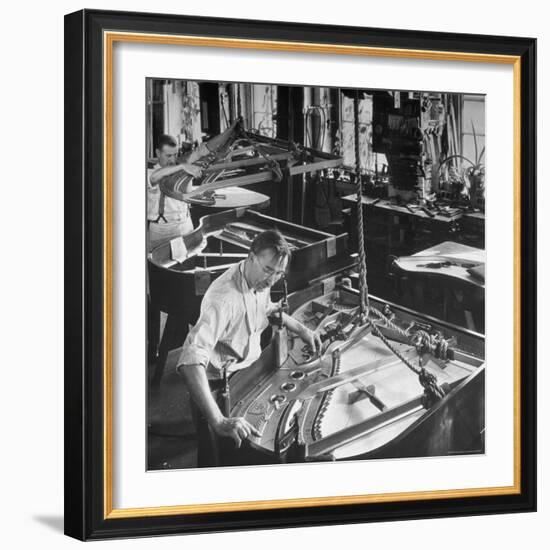 Workmen Installing Steel String Frames Into Grand Piano Cabinets at Steinway Piano Factory-Margaret Bourke-White-Framed Photographic Print