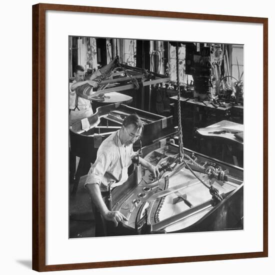 Workmen Installing Steel String Frames Into Grand Piano Cabinets at Steinway Piano Factory-Margaret Bourke-White-Framed Photographic Print