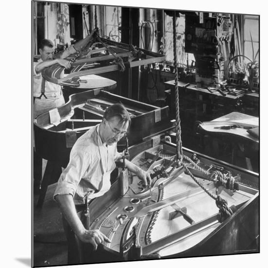 Workmen Installing Steel String Frames Into Grand Piano Cabinets at Steinway Piano Factory-Margaret Bourke-White-Mounted Photographic Print