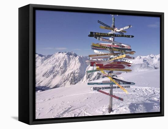 Worldwide Signpost in Ischgl, Austria-Martina Bleichner-Framed Stretched Canvas