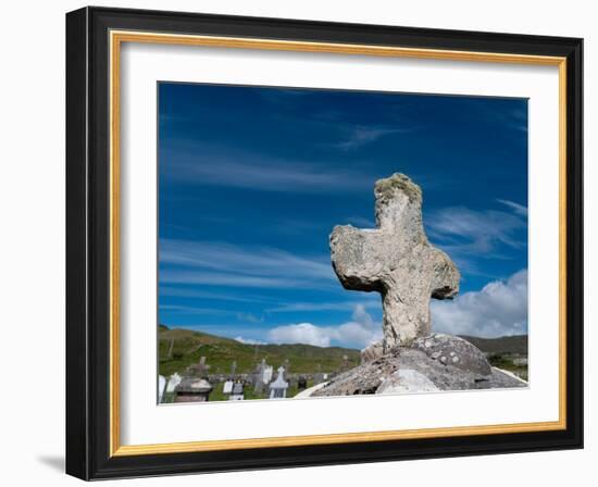 Worn stone cross adorns a grave in Kildavnet, Achill Island, County Mayo, Ireland.-Betty Sederquist-Framed Photographic Print