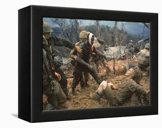 Wounded Marine Gunnery Sgt. Jeremiah Purdie During the Vietnam War-Larry Burrows-Framed Premier Image Canvas