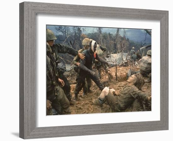 Wounded Marine Gunnery Sgt. Jeremiah Purdie During the Vietnam War-Larry Burrows-Framed Photographic Print