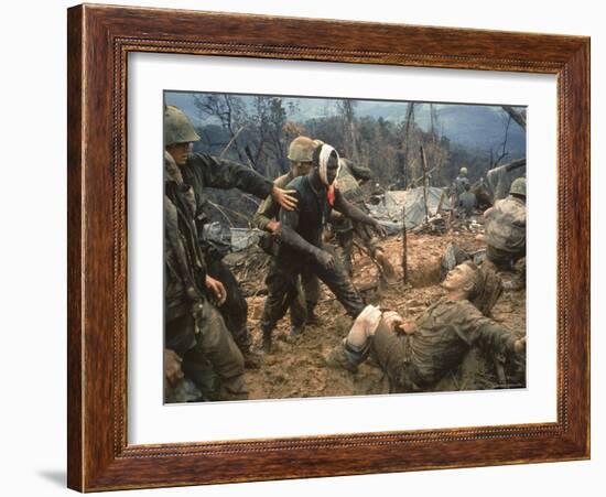 Wounded Marine Gunnery Sgt. Jeremiah Purdie During the Vietnam War-Larry Burrows-Framed Photographic Print