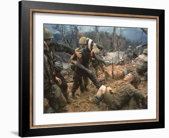 Wounded Marine Gunnery Sgt. Jeremiah Purdie During the Vietnam War-Larry Burrows-Framed Photographic Print