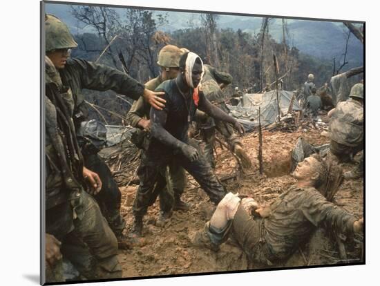 Wounded Marine Gunnery Sgt. Jeremiah Purdie During the Vietnam War-Larry Burrows-Mounted Photographic Print