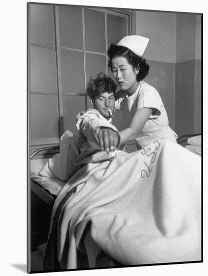 Wounded Marine Walter McCorkle Being Treated at a Hospital in Japan-null-Mounted Photographic Print