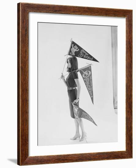 Writer Gloria Steinem Carrying Pennants for Professional Football Teams-Yale Joel-Framed Premium Photographic Print