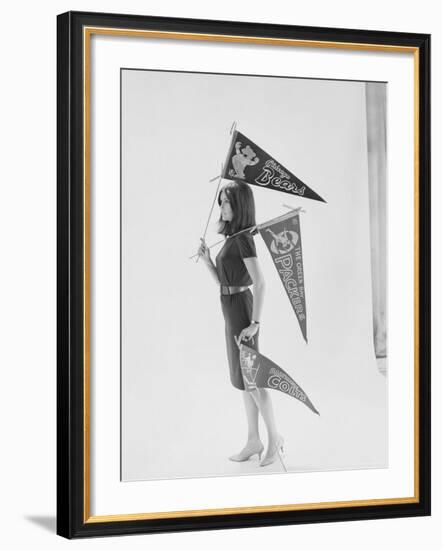 Writer Gloria Steinem Carrying Pennants for Professional Football Teams-Yale Joel-Framed Premium Photographic Print
