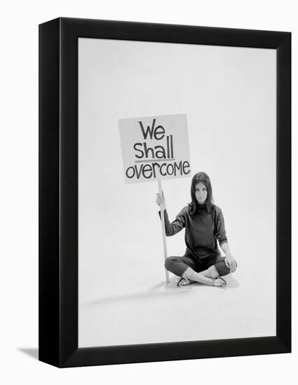 Writer Gloria Steinem Sitting on Floor with Sign "We Shall Overcome" Regarding Pop Culture-Yale Joel-Framed Premier Image Canvas