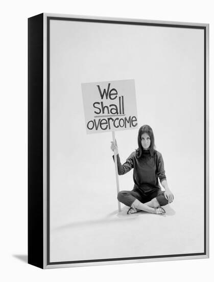 Writer Gloria Steinem Sitting on Floor with Sign "We Shall Overcome" Regarding Pop Culture-Yale Joel-Framed Premier Image Canvas