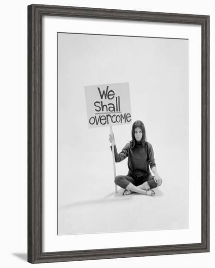 Writer Gloria Steinem Sitting on Floor with Sign "We Shall Overcome" Regarding Pop Culture-Yale Joel-Framed Premium Photographic Print