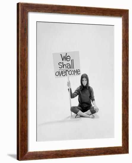 Writer Gloria Steinem Sitting on Floor with Sign "We Shall Overcome" Regarding Pop Culture-Yale Joel-Framed Premium Photographic Print