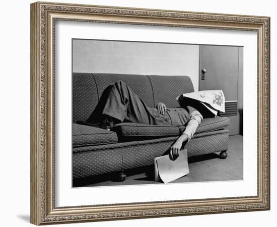 Writer Niven Busch Lying on Sofa with Newspaper over His Face as He Takes Nap from Screenwriting-Paul Dorsey-Framed Photographic Print