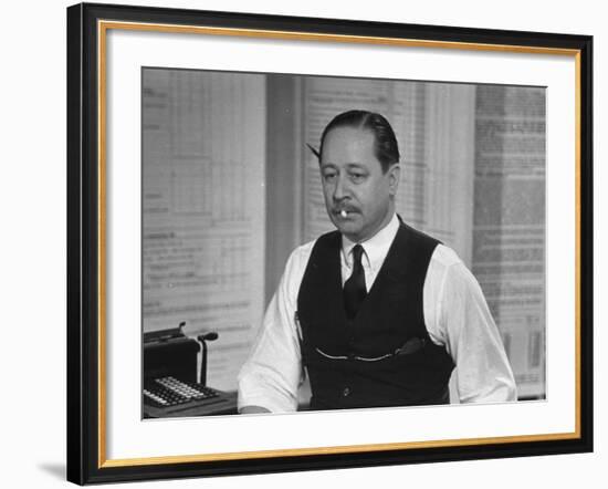 Writer Robert Benchley, Sitting at His Desk with a Small Wade of Paper in His Mouth-Bernard Hoffman-Framed Premium Photographic Print