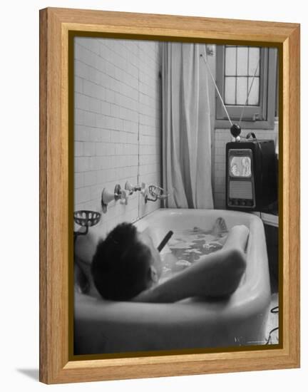 Writer Russell Finch Taking Portable Television Set to Bathroom During His Bath-George Skadding-Framed Premier Image Canvas