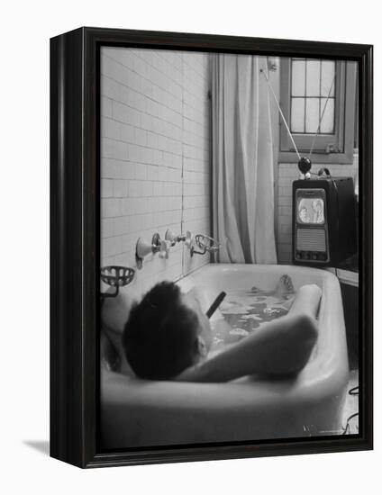 Writer Russell Finch Taking Portable Television Set to Bathroom During His Bath-George Skadding-Framed Premier Image Canvas