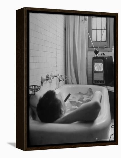 Writer Russell Finch Taking Portable Television Set to Bathroom During His Bath-George Skadding-Framed Premier Image Canvas