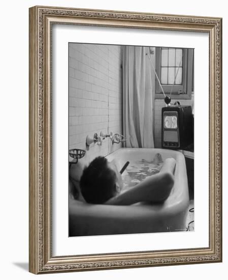 Writer Russell Finch Taking Portable Television Set to Bathroom During His Bath-George Skadding-Framed Premium Photographic Print