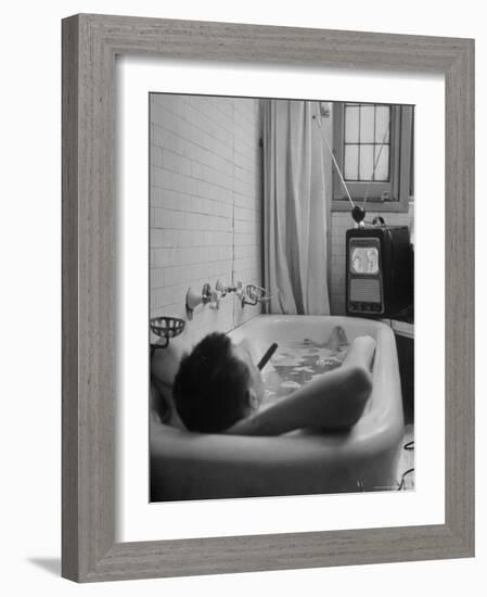 Writer Russell Finch Taking Portable Television Set to Bathroom During His Bath-George Skadding-Framed Premium Photographic Print