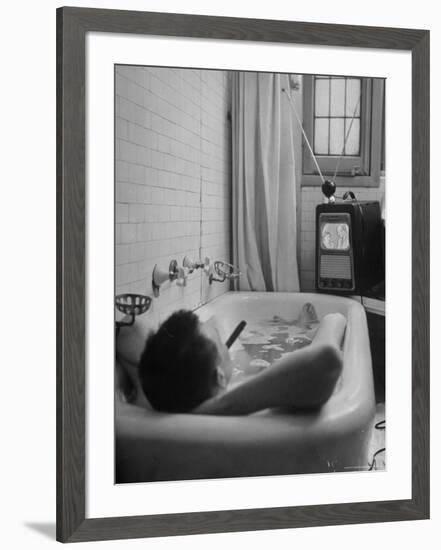 Writer Russell Finch Taking Portable Television Set to Bathroom During His Bath-George Skadding-Framed Photographic Print