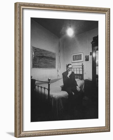 Writer William S. Burroughs Smoking on Bed in His Hotel Room-Loomis Dean-Framed Premium Photographic Print