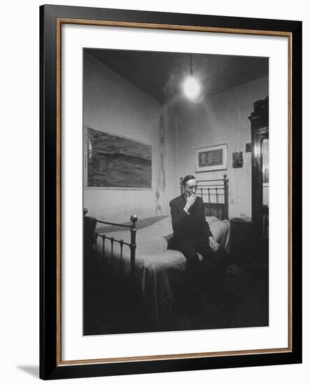 Writer William S. Burroughs Smoking on Bed in His Hotel Room-Loomis Dean-Framed Premium Photographic Print