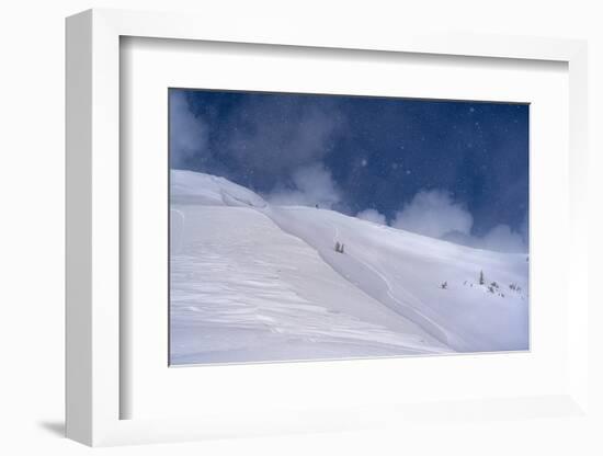 Wyoming. Man getting ready for descent of Mount Taylor, highest peak in Southern Teton Mountains-Howie Garber-Framed Photographic Print