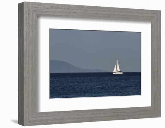 Yacht. Sailing Boat. Sailboat White Sail Boat between Blue Sky and Dark Blue Sea. an Island on Fore-PROtoys-Framed Photographic Print
