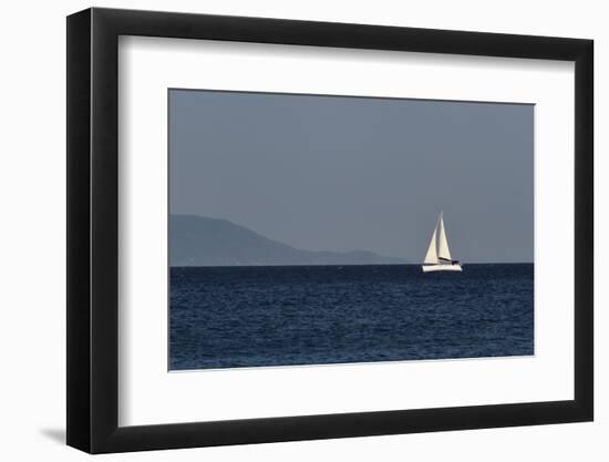 Yacht. Sailing Boat. Sailboat White Sail Boat between Blue Sky and Dark Blue Sea. an Island on Fore-PROtoys-Framed Photographic Print