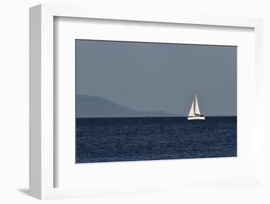 Yacht. Sailing Boat. Sailboat White Sail Boat between Blue Sky and Dark Blue Sea. an Island on Fore-PROtoys-Framed Photographic Print