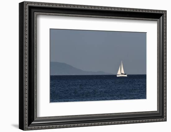 Yacht. Sailing Boat. Sailboat White Sail Boat between Blue Sky and Dark Blue Sea. an Island on Fore-PROtoys-Framed Photographic Print