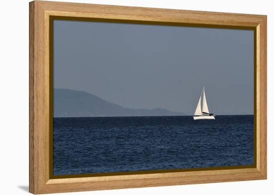 Yacht. Sailing Boat. Sailboat White Sail Boat between Blue Sky and Dark Blue Sea. an Island on Fore-PROtoys-Framed Premier Image Canvas