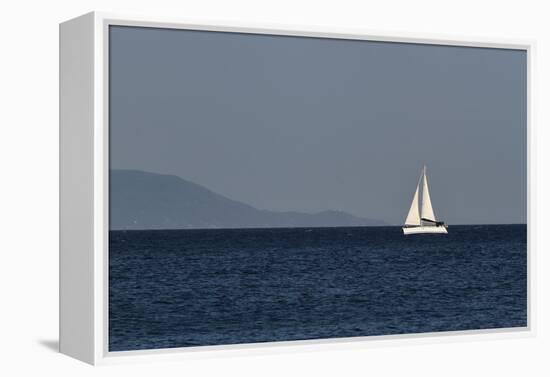 Yacht. Sailing Boat. Sailboat White Sail Boat between Blue Sky and Dark Blue Sea. an Island on Fore-PROtoys-Framed Premier Image Canvas