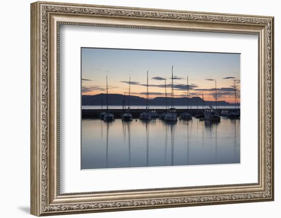 Yachts moored in The Cobb with Jurassic Coast and Golden Cap at sunrise, Lyme Regis, Dorset, Englan-Stuart Black-Framed Photographic Print