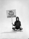 Writer Gloria Steinem Sitting on Floor with Sign "We Shall Overcome" Regarding Pop Culture-Yale Joel-Premium Photographic Print