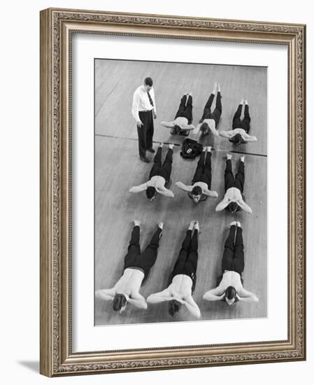 Yale University Swimmers Do Strengthening Exercises on Floor of Gym-Alfred Eisenstaedt-Framed Photographic Print