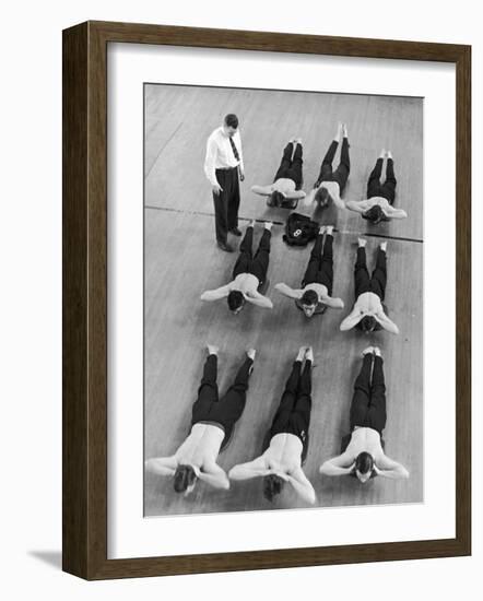 Yale University Swimmers Do Strengthening Exercises on Floor of Gym-Alfred Eisenstaedt-Framed Photographic Print