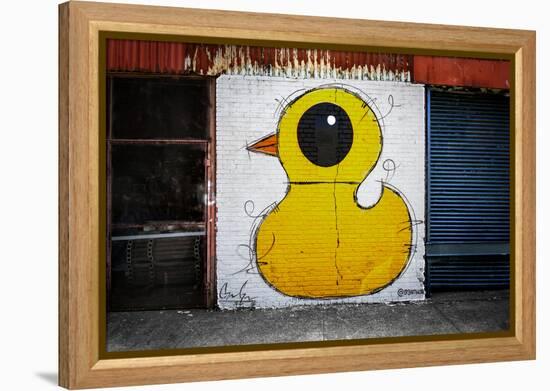 Yellow Duck on Brick Wall in Brooklyn NY-null-Framed Stretched Canvas