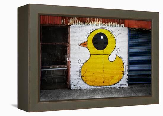 Yellow Duck on Brick Wall in Brooklyn NY-null-Framed Stretched Canvas