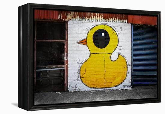 Yellow Duck on Brick Wall in Brooklyn NY-null-Framed Stretched Canvas