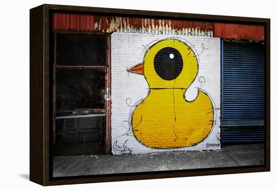 Yellow Duck on Brick Wall in Brooklyn NY-null-Framed Stretched Canvas